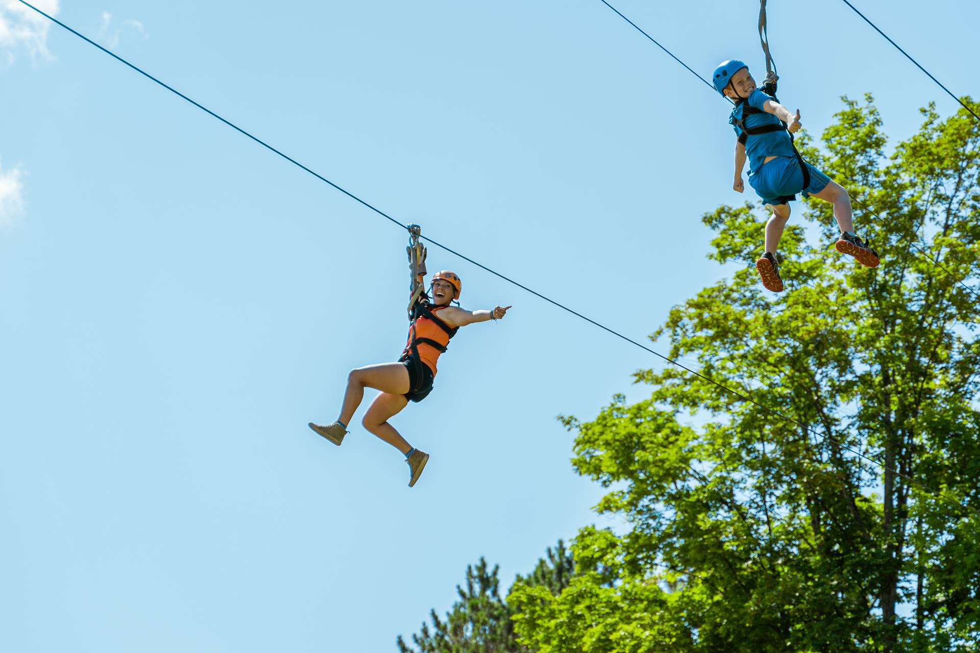 Guest and zipline guide riding twin zip
