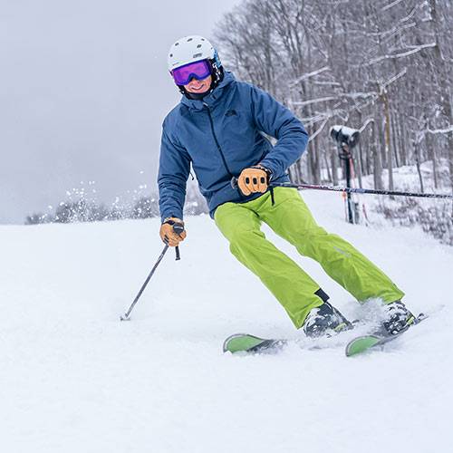 man skiing at Boyne Mountain resort in winter