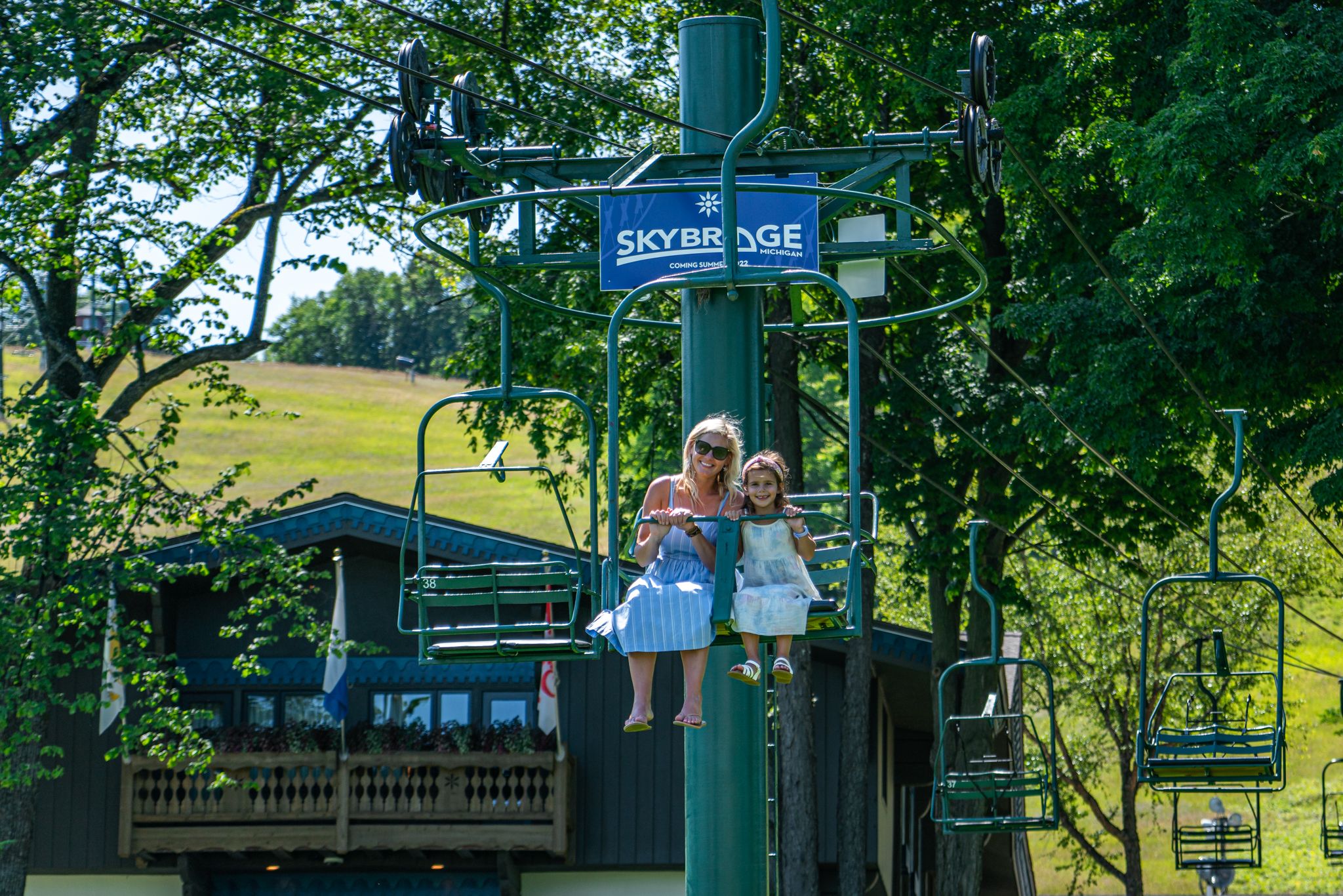 Mother and daughter riding the Hemlock scenic chairlift