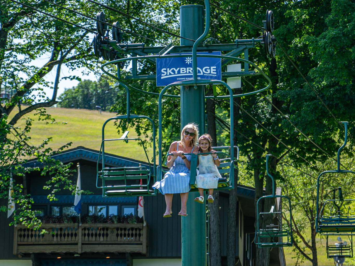 Mother and daughter riding the Hemlock scenic chairlift