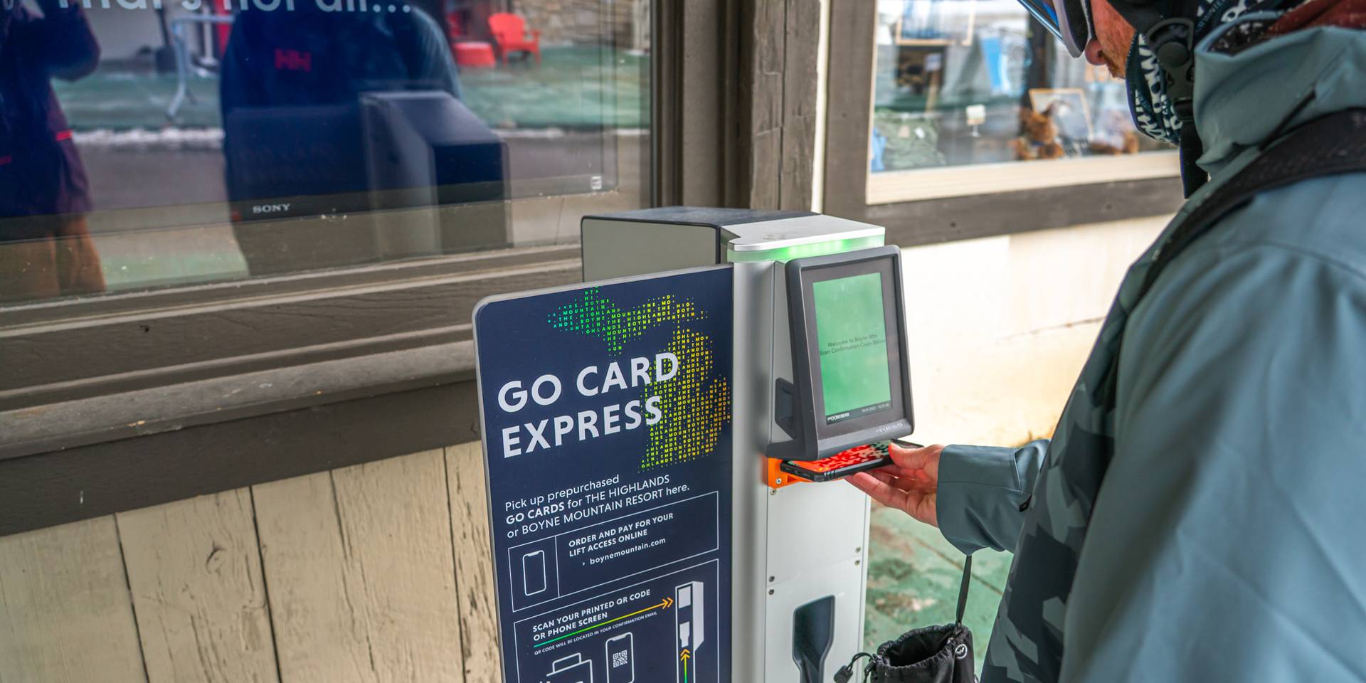 person scanning barcode at pick up box