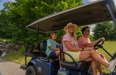family on scenic cart