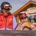 Mom and young daughter eating waffle from Waffle Cabin
