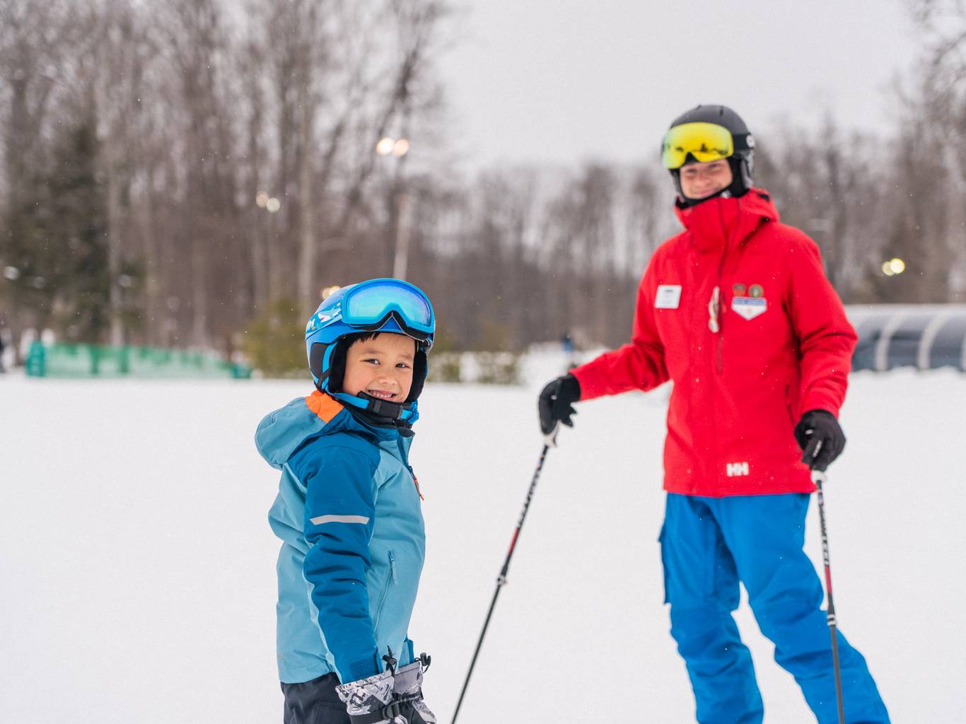 Young child with ski instructor