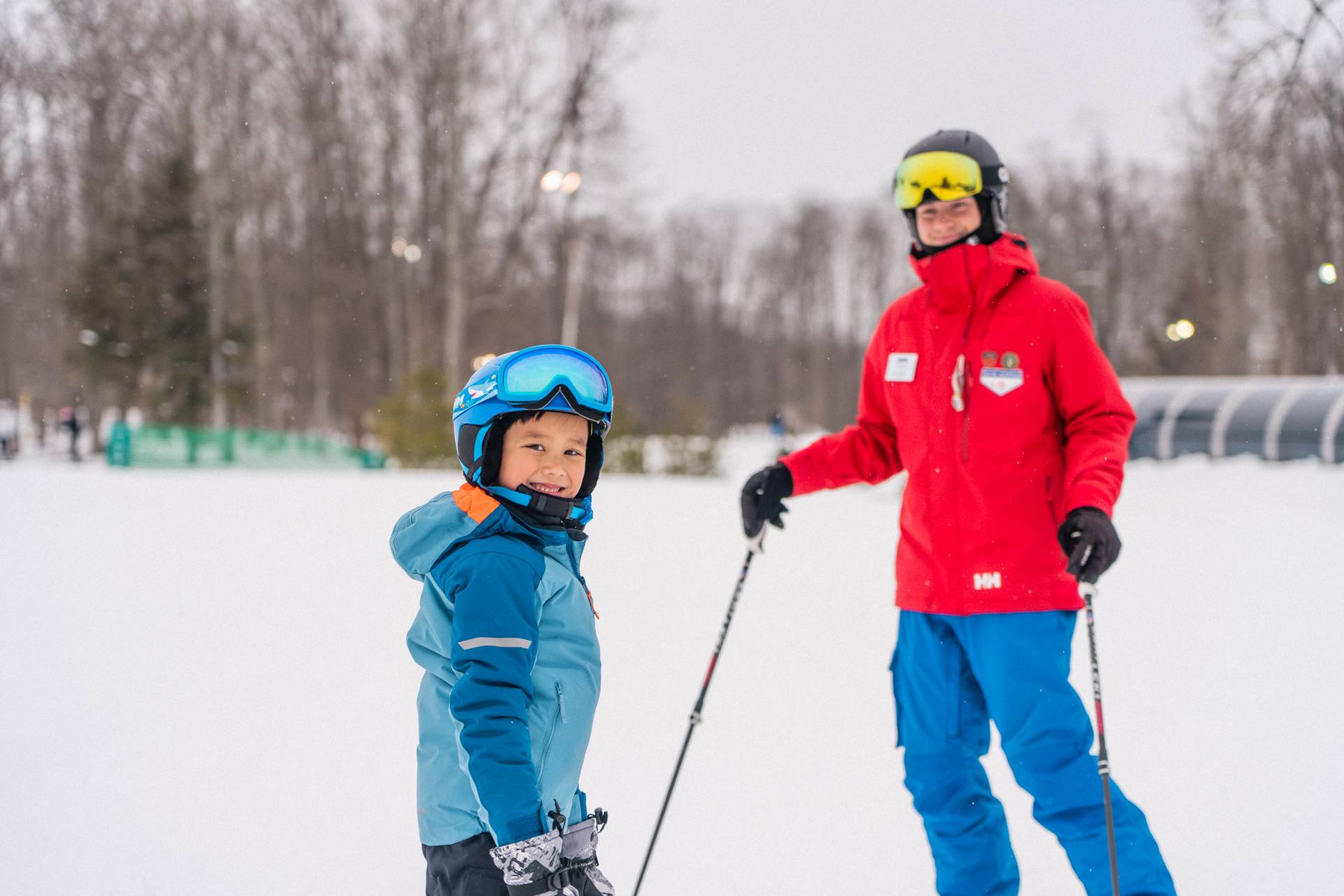 Child with ski instructor
