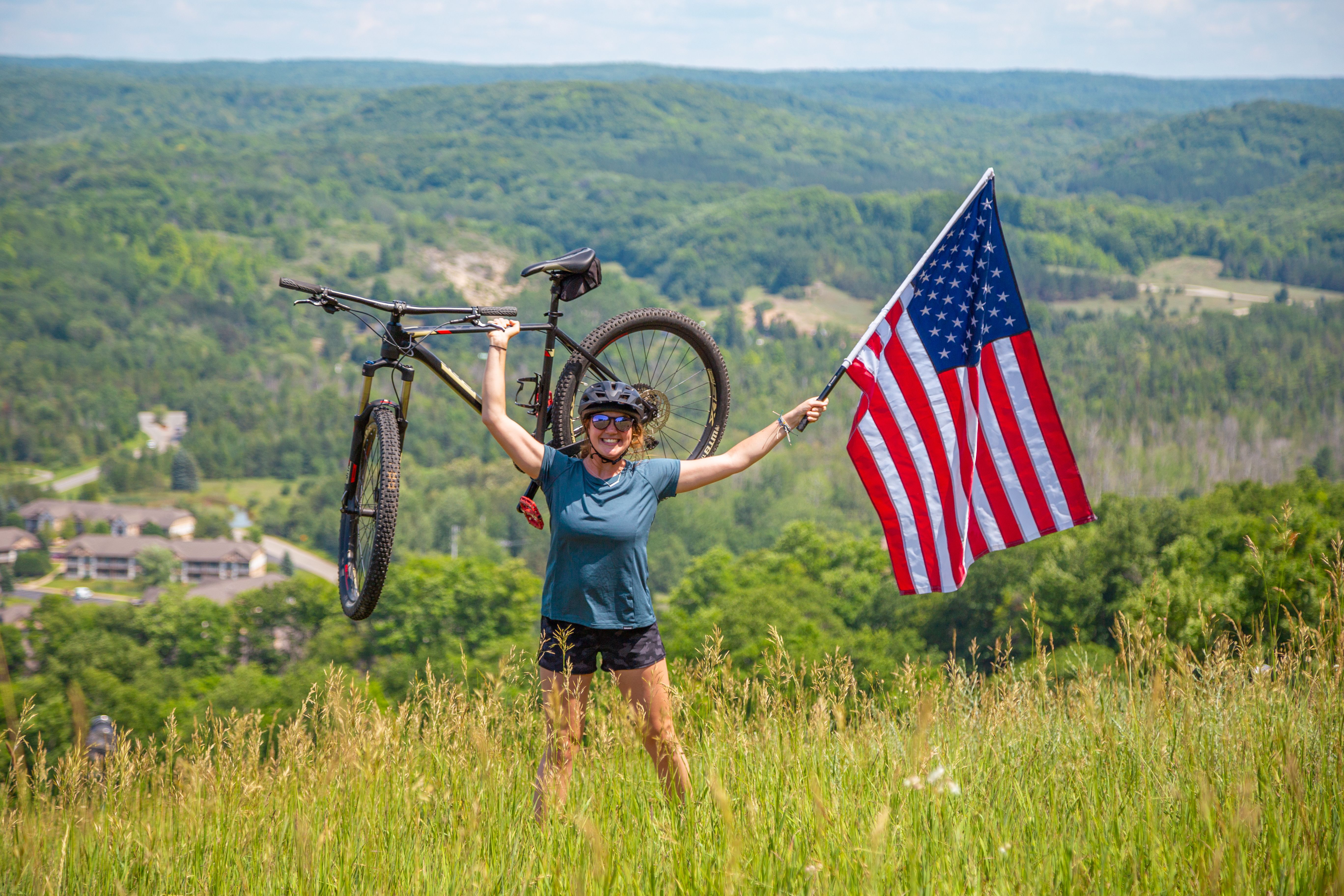 person biking with American flag