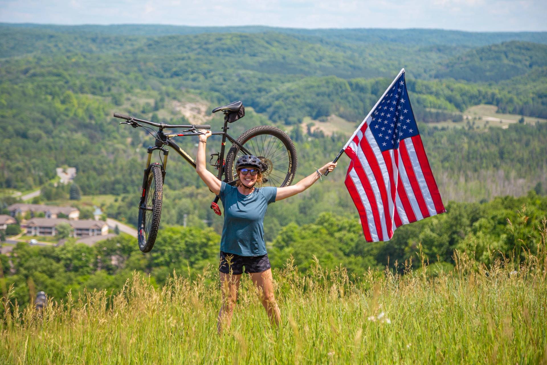person biking with American flag