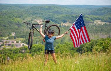 person biking with American flag