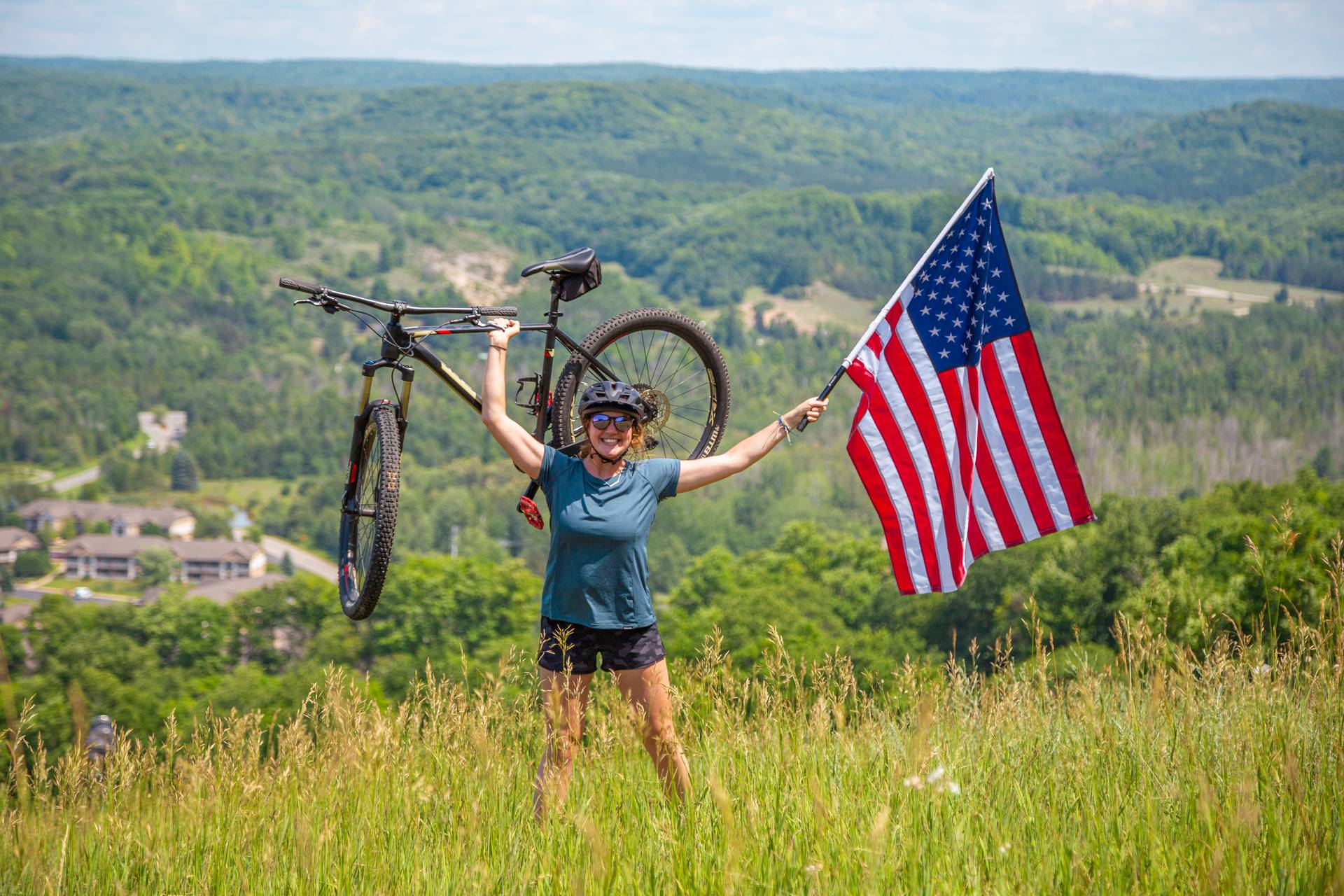 person biking with American flag