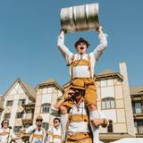 friends wearing lederhosen at skitoberfest