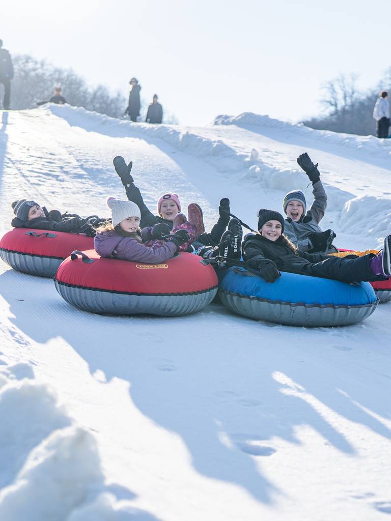 Kid's joined together tubing down