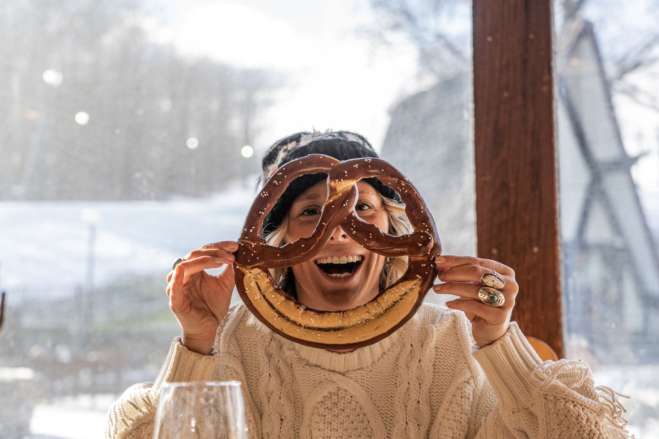 Person holding large pretzel