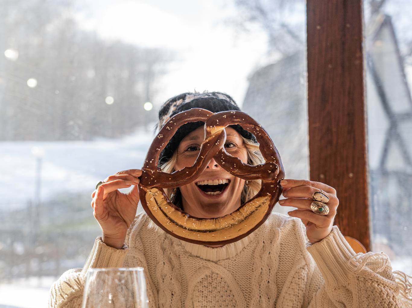 Person holding large pretzel