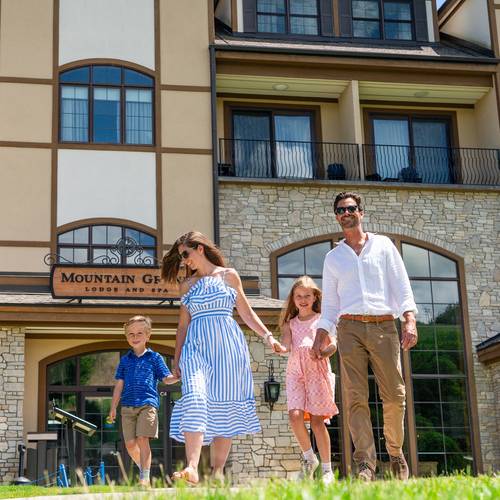 Family walking out of the Mountain Grand Lodge and Spa