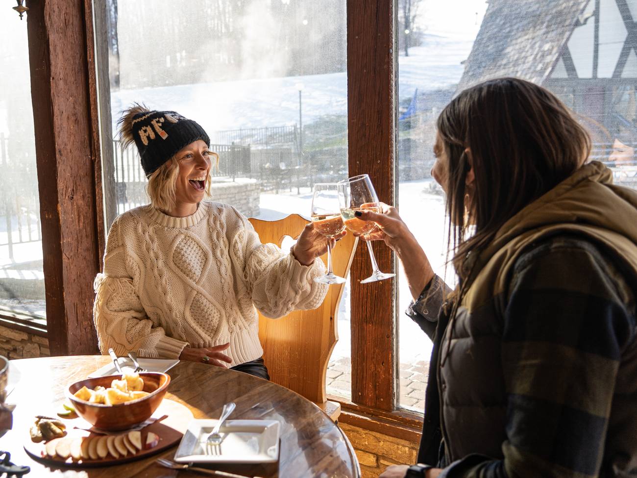 Ladies cheersing winie
