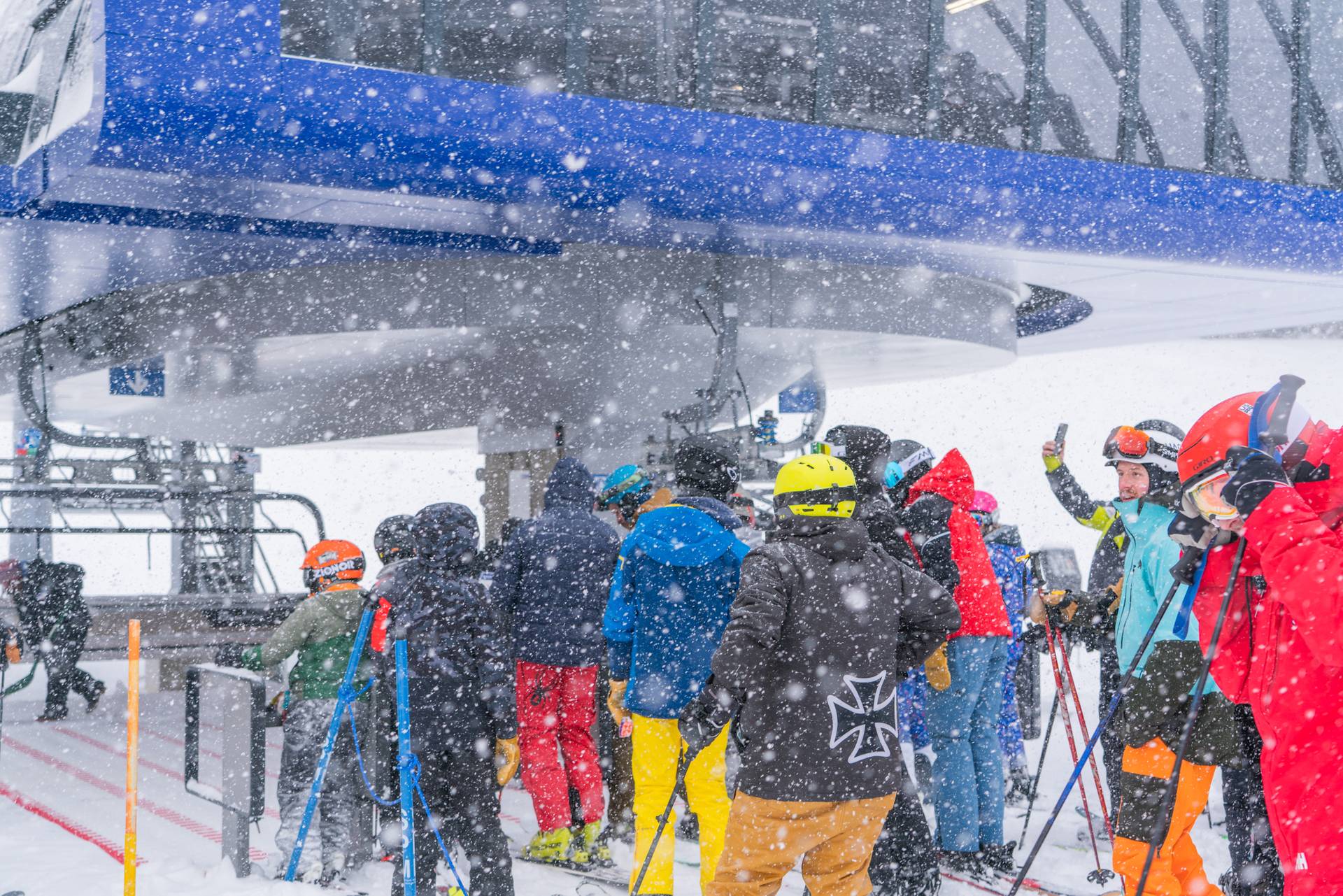People loading D8 lift on a snowy day.