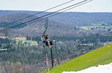 riders on chairlift