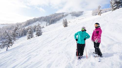 two women on side of slope