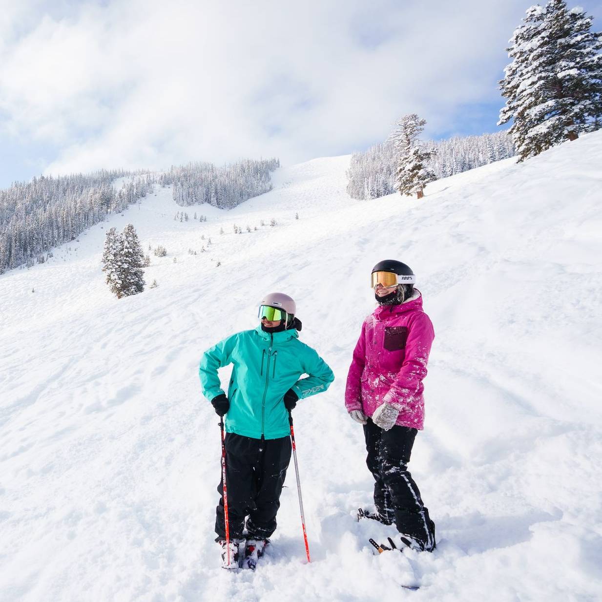 Skier and snowboarder in powder