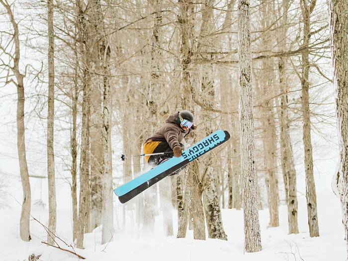 pro skier riding glades