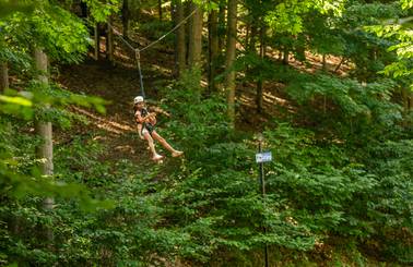 young girl ziplining