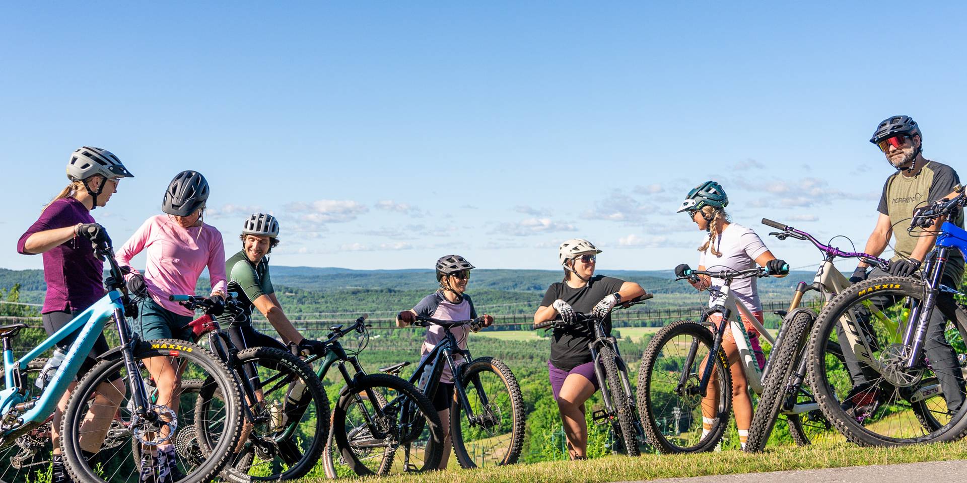 friends riding bikes at the top at boyne mountain