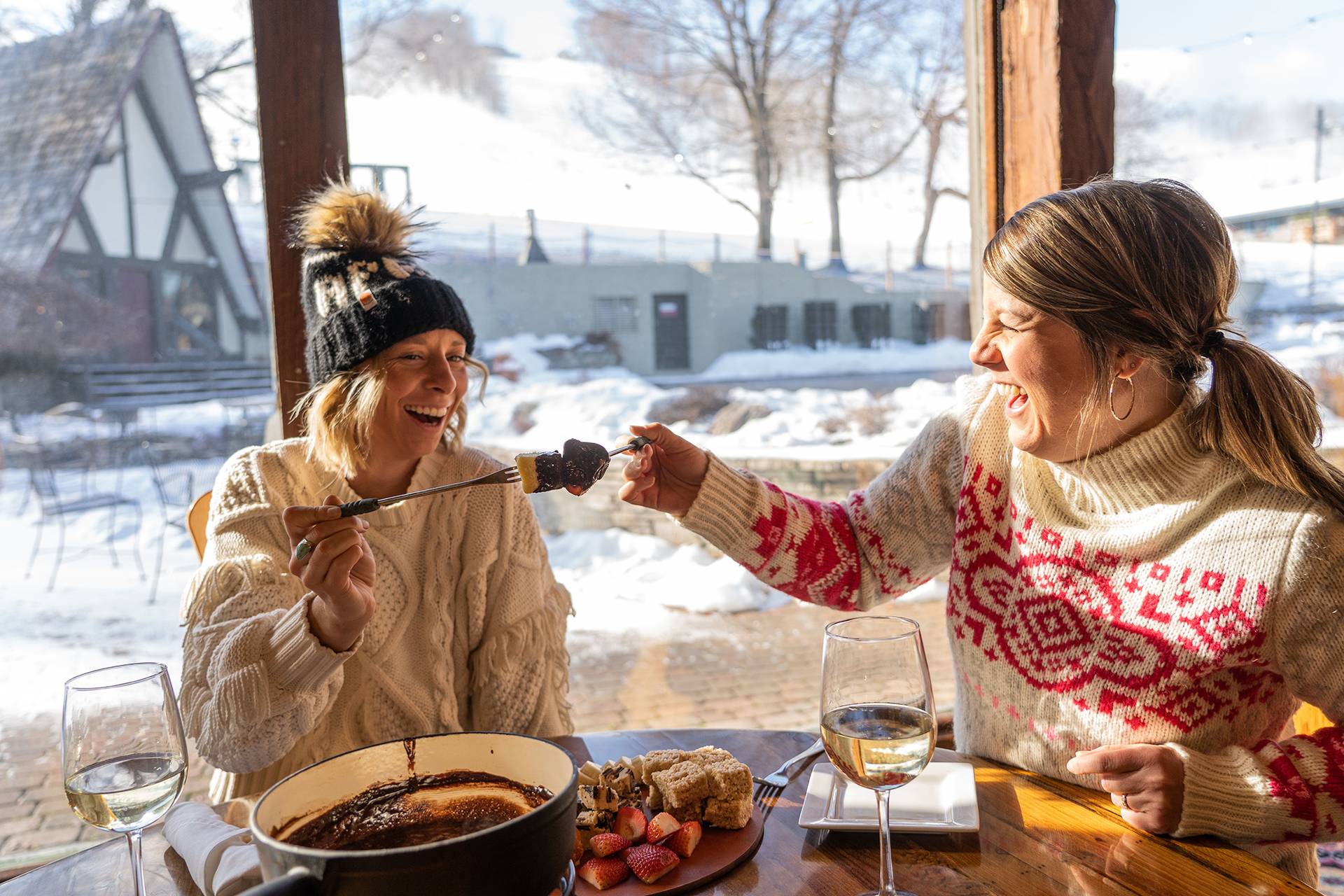 Ladies enjoying fondue at Stein Eriksen's