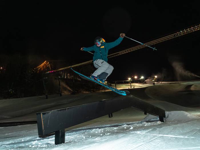 skier hitting park at night