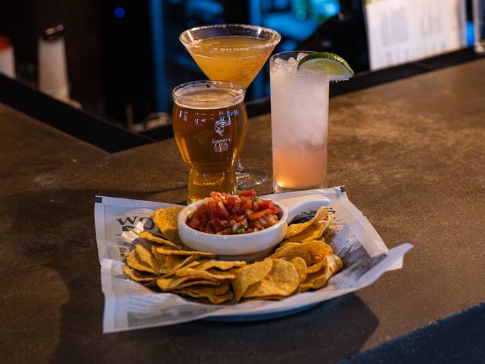 Drinks and plate of nachos at Forty Acres Tavern