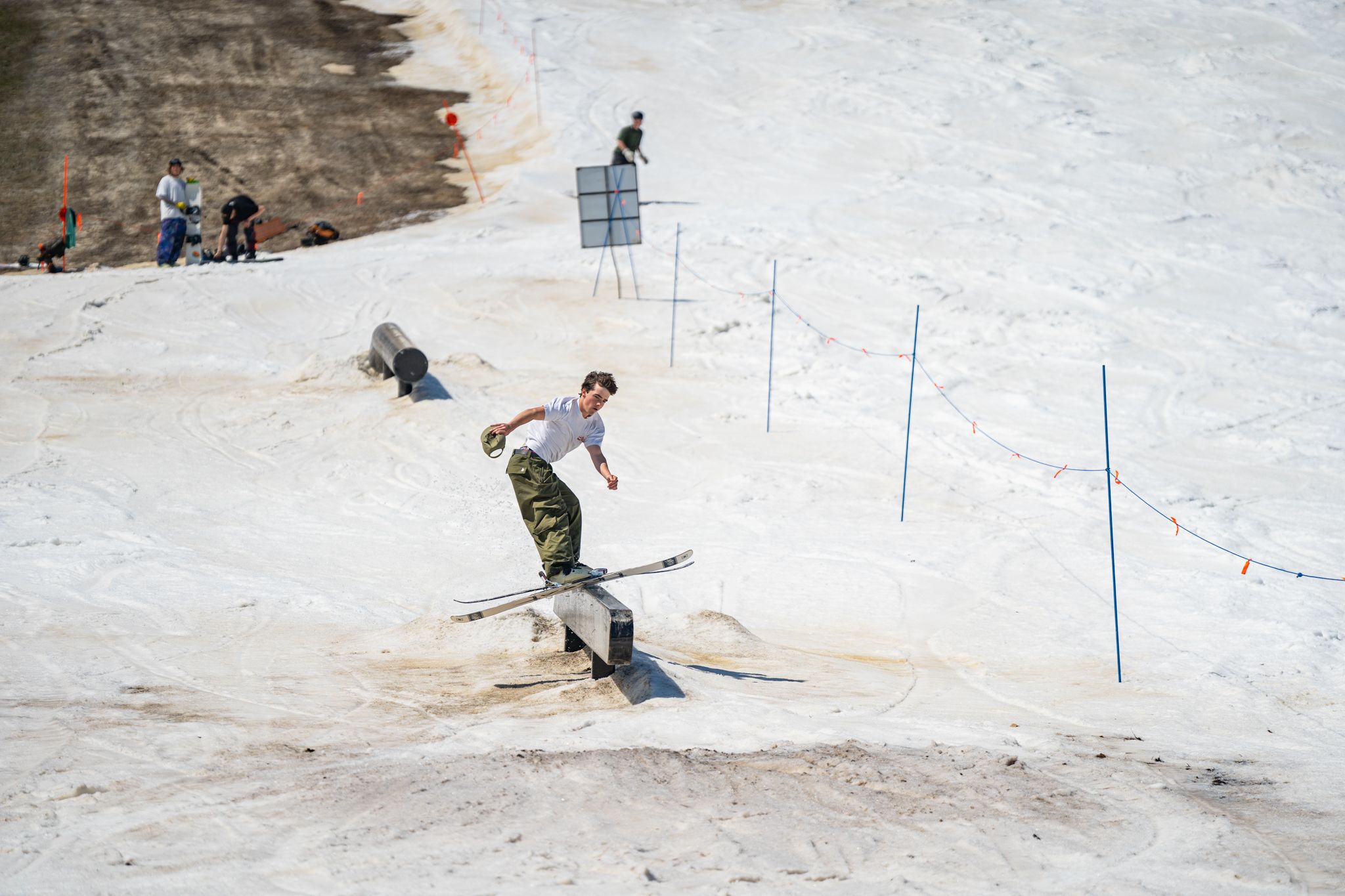 skier on rail in late season