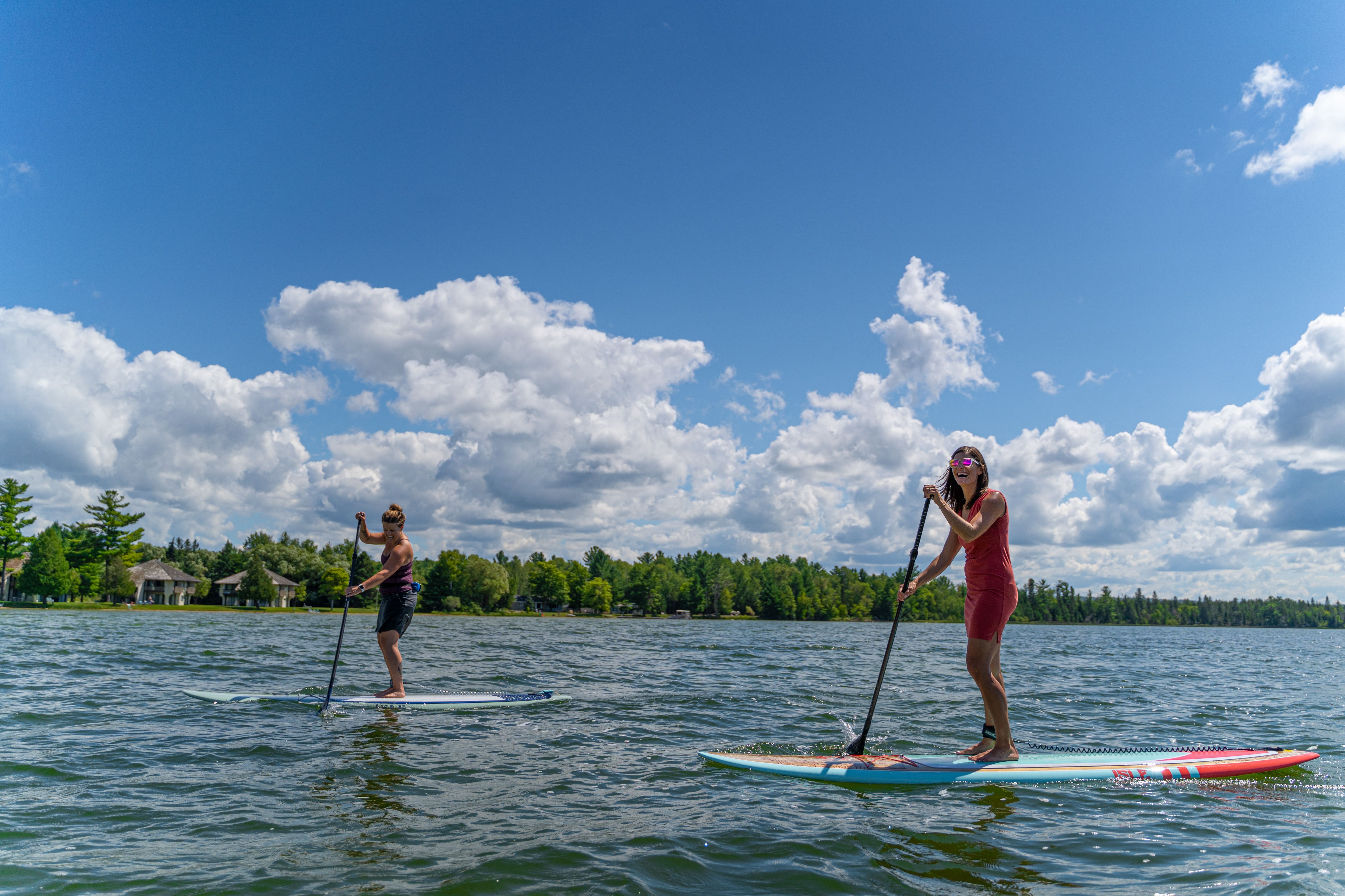 two friends on paddle boards