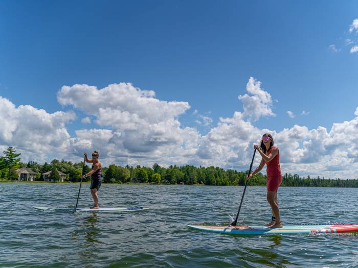 two friends on paddle boards