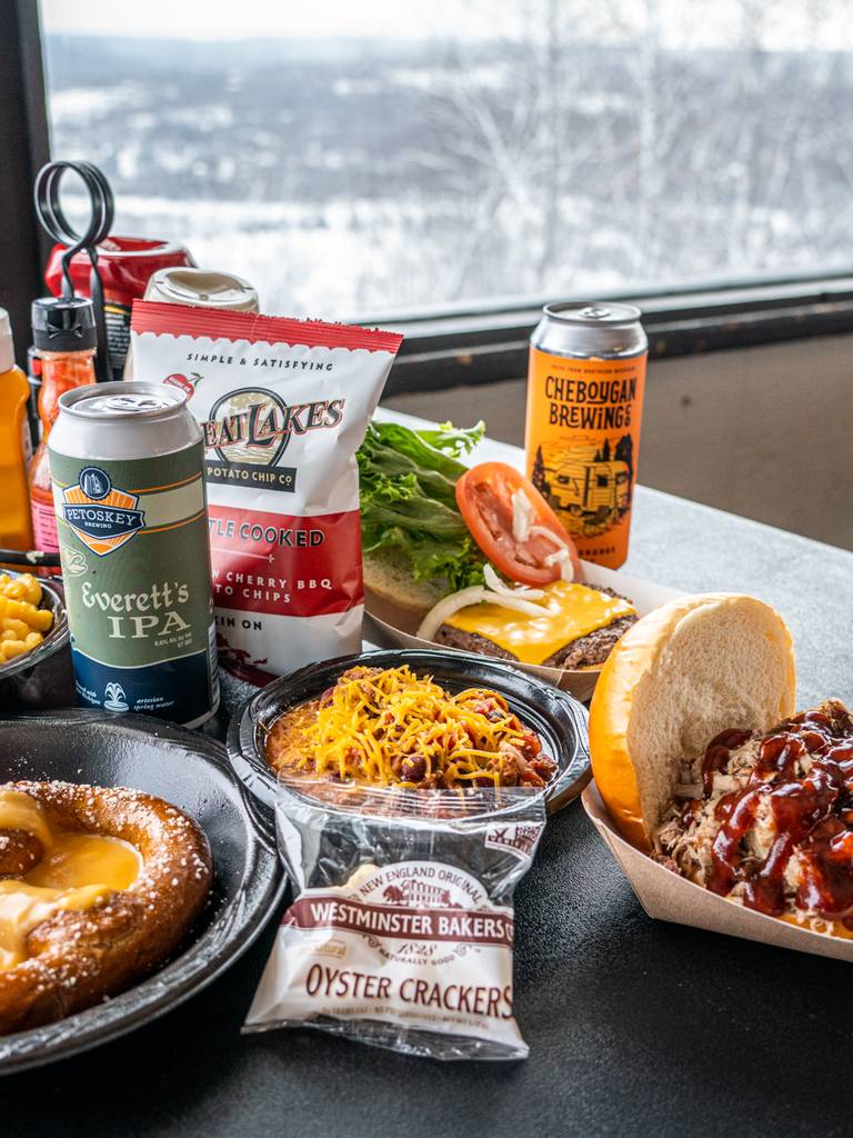 Kids sitting by the fire inside Eagle's Nest
