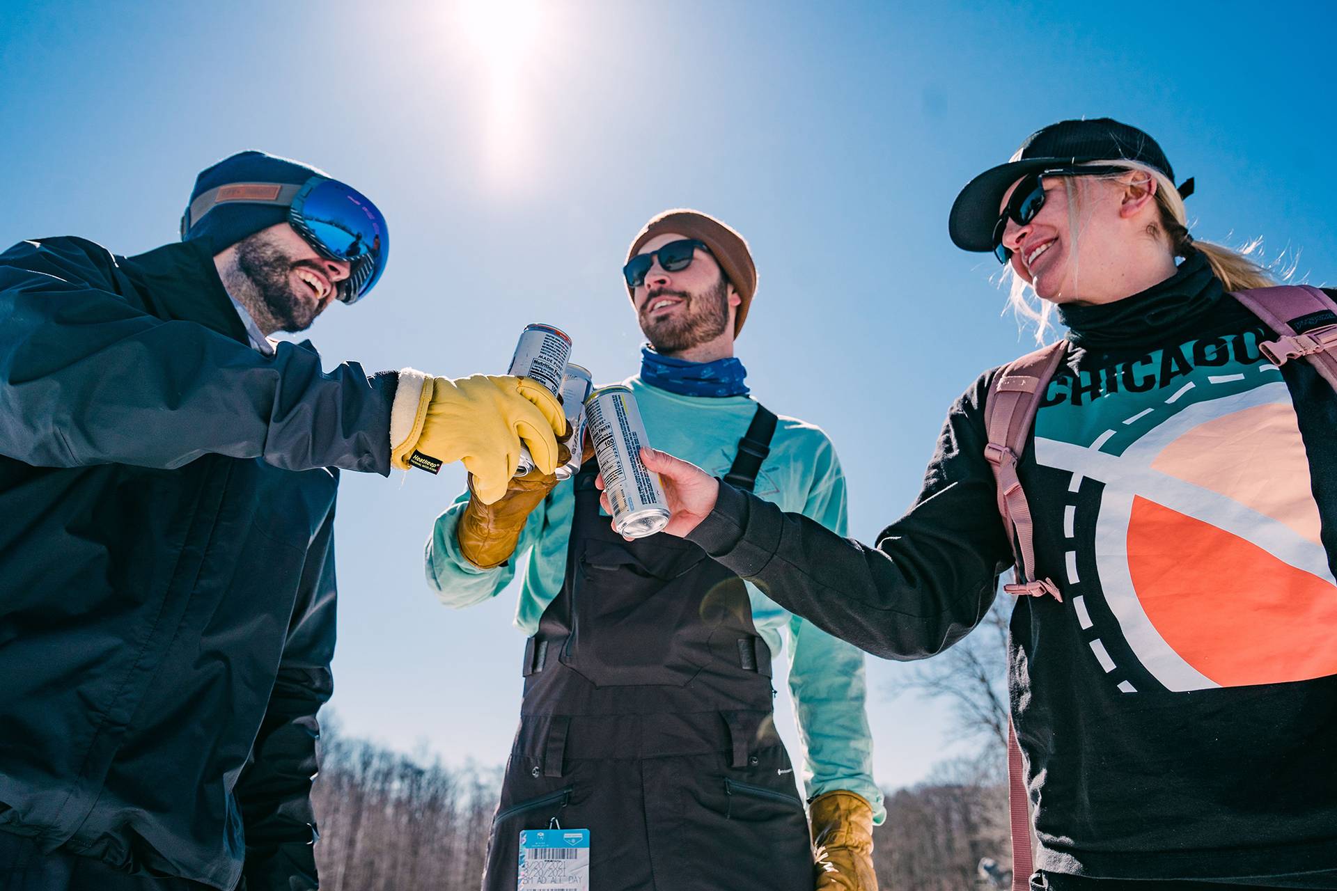 Three guys giving cheers to each other