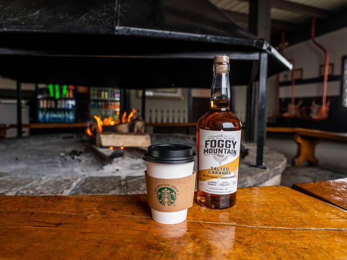 Winter cocktail sitting by the fireplace inside Eagle's Nest