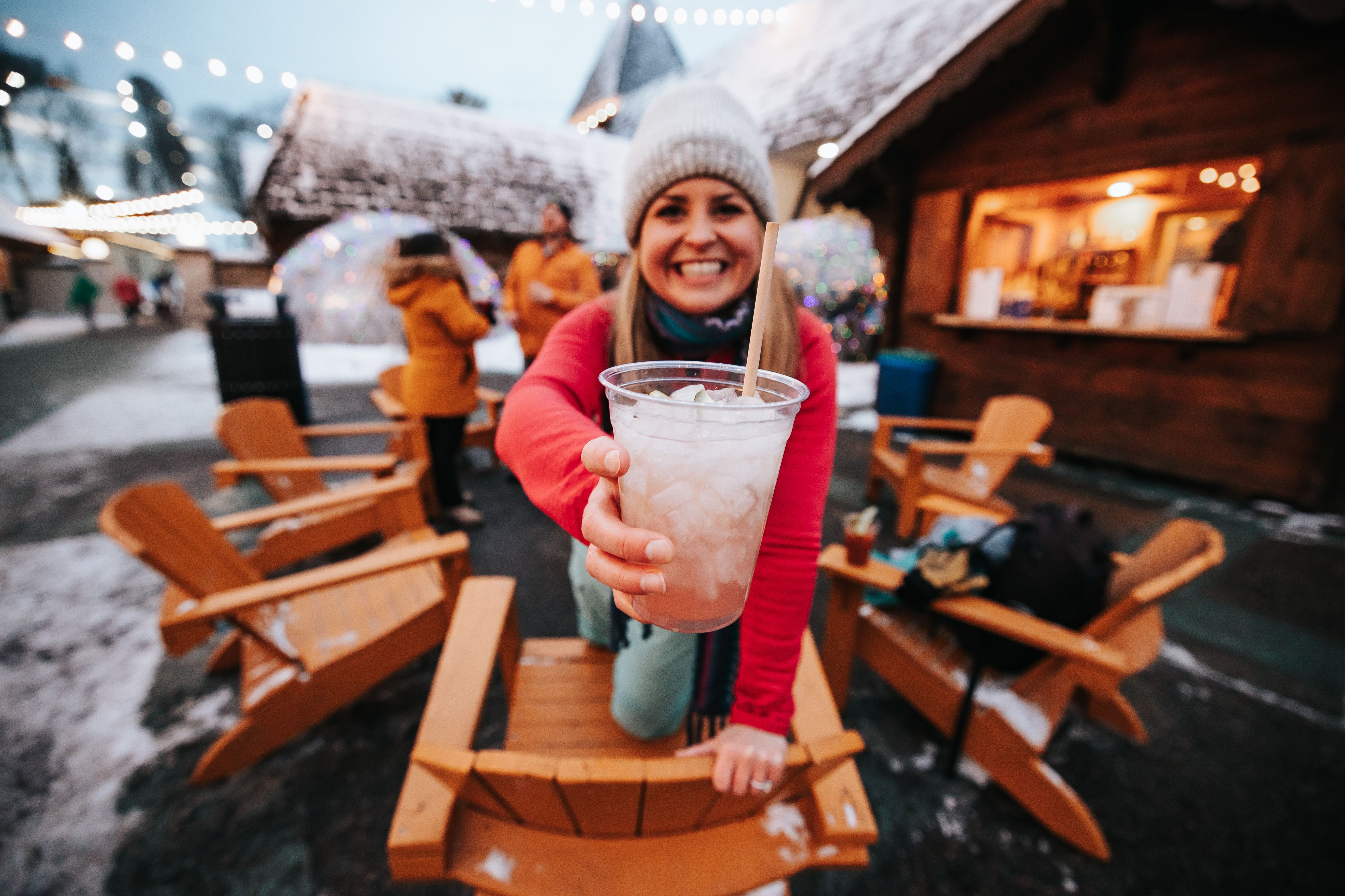 lady with mixed drink in Back Forty smiling