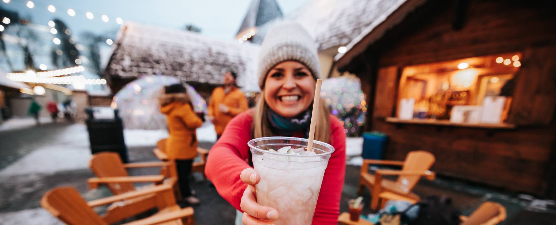 lady with mixed drink in Back Forty smiling