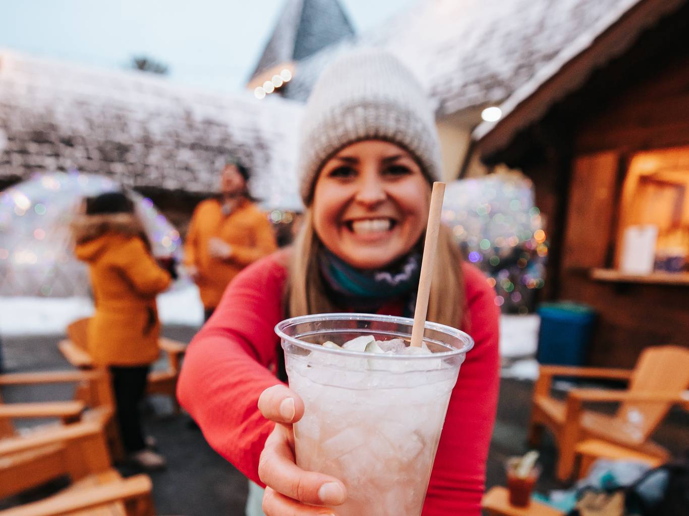 lady with mixed drink in Back Forty smiling