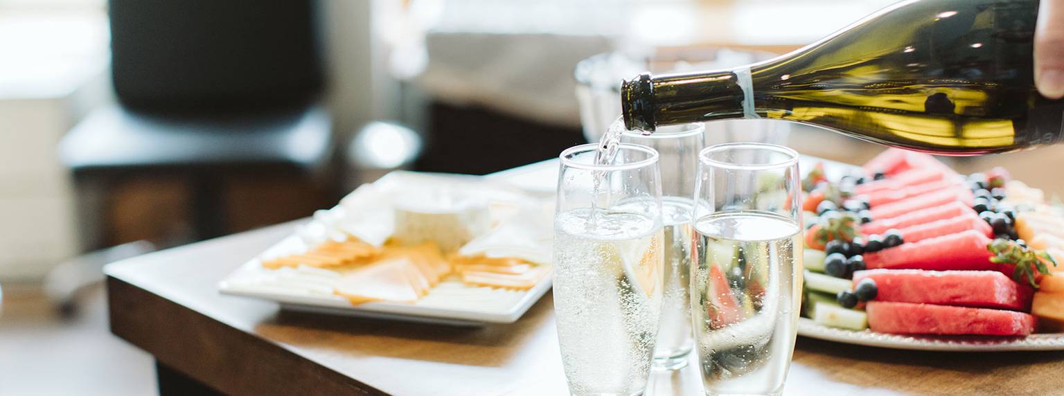 pouring champagne at The Spa