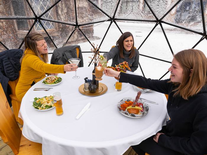 Ladies giving cheers in an igloo