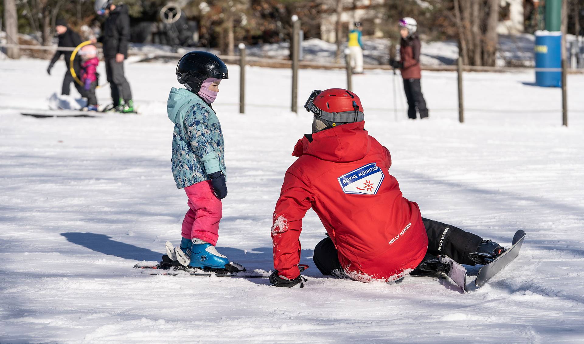 child in ski lesson