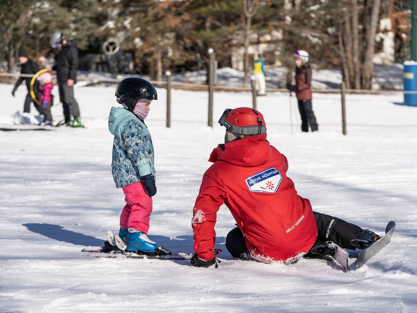 Young child with ski instructor