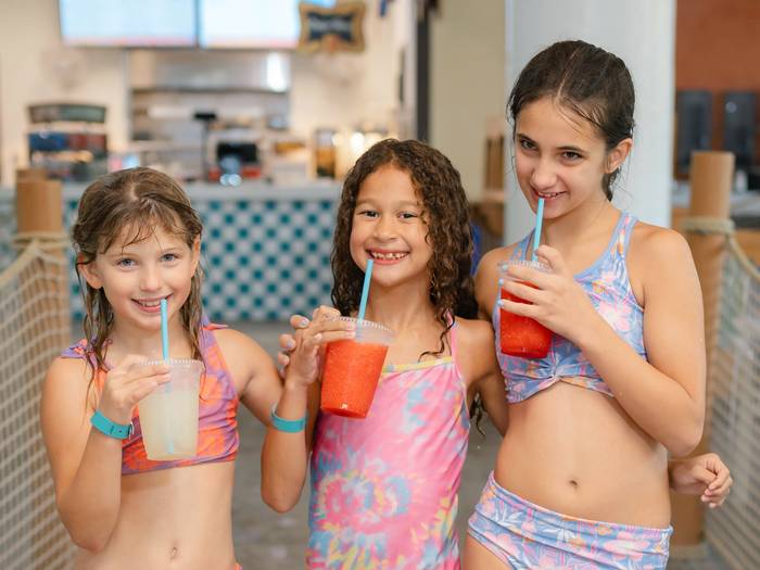 Young girls drinking slushies