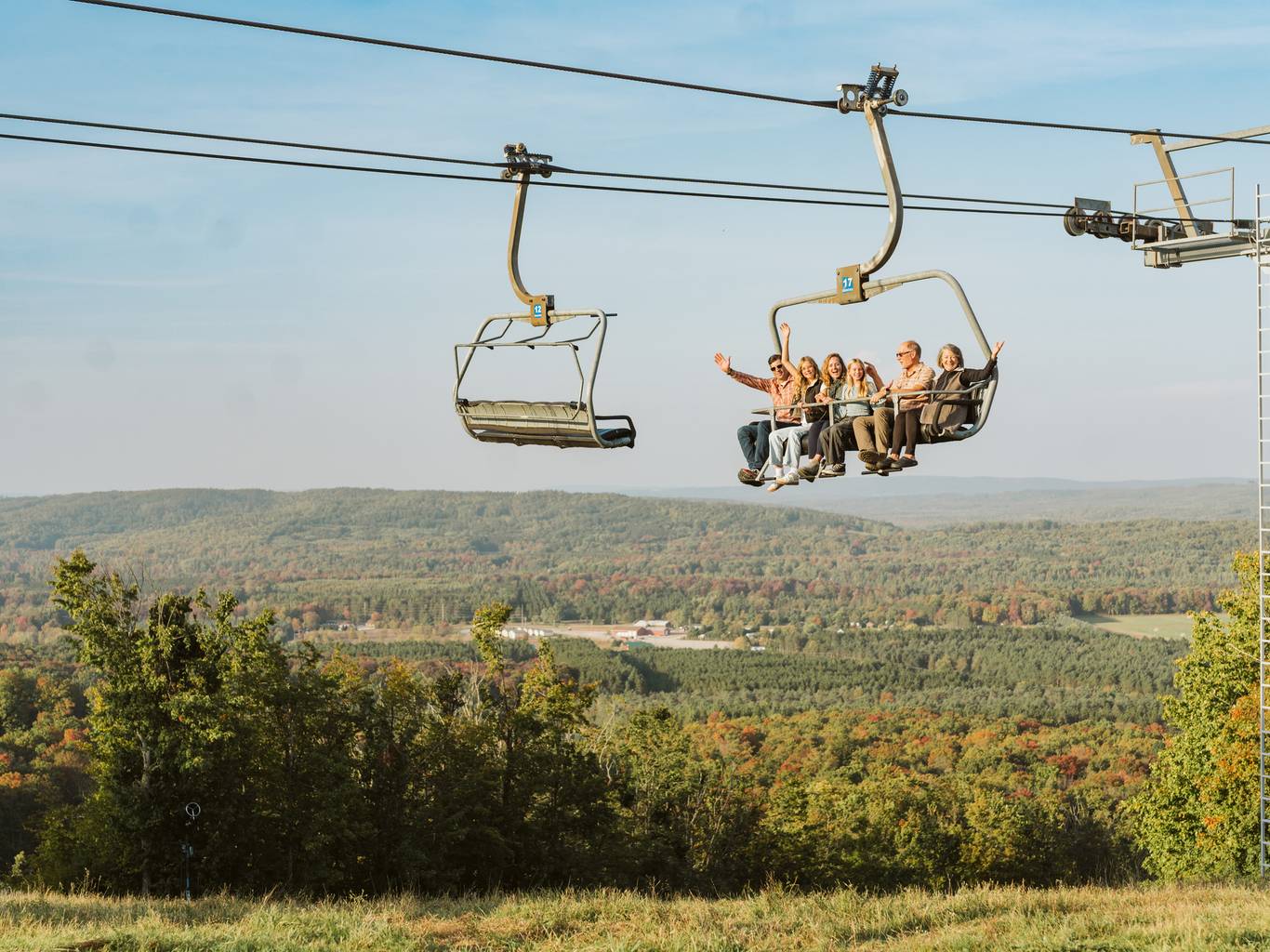 Family riding the Mountain Express scenic chairlift