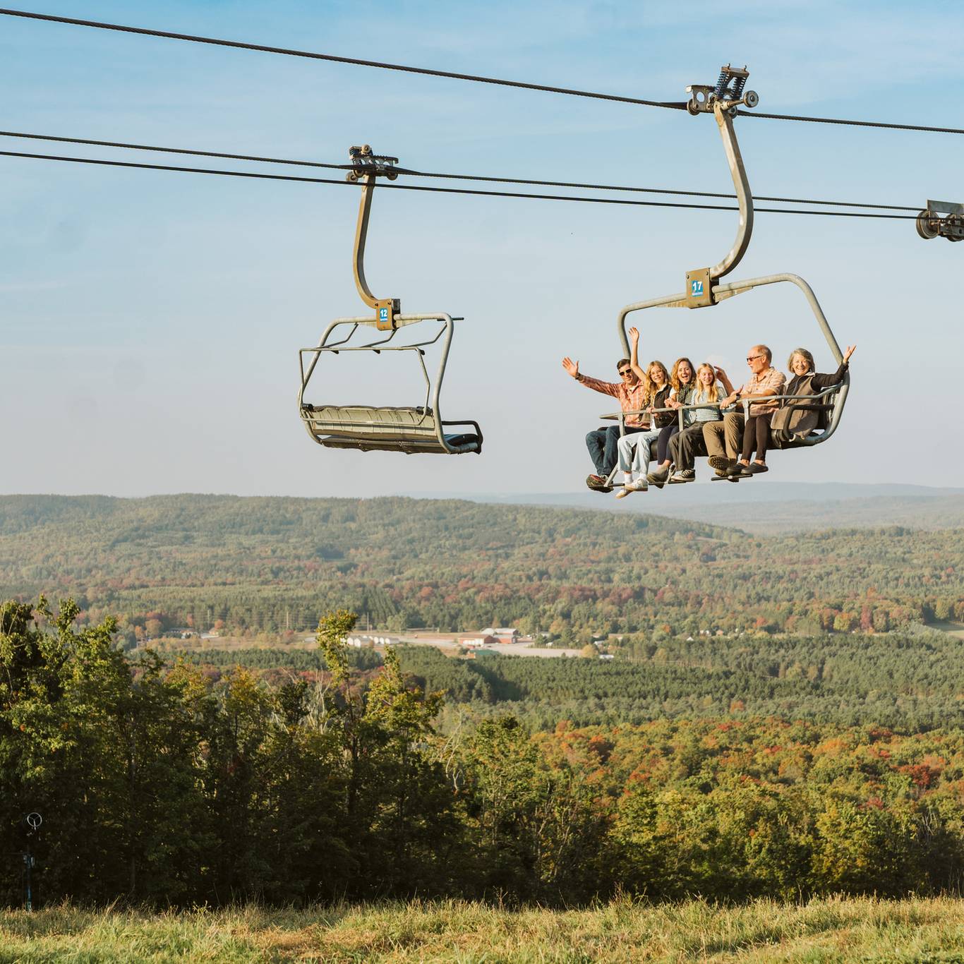 family on scenic chairlift ride