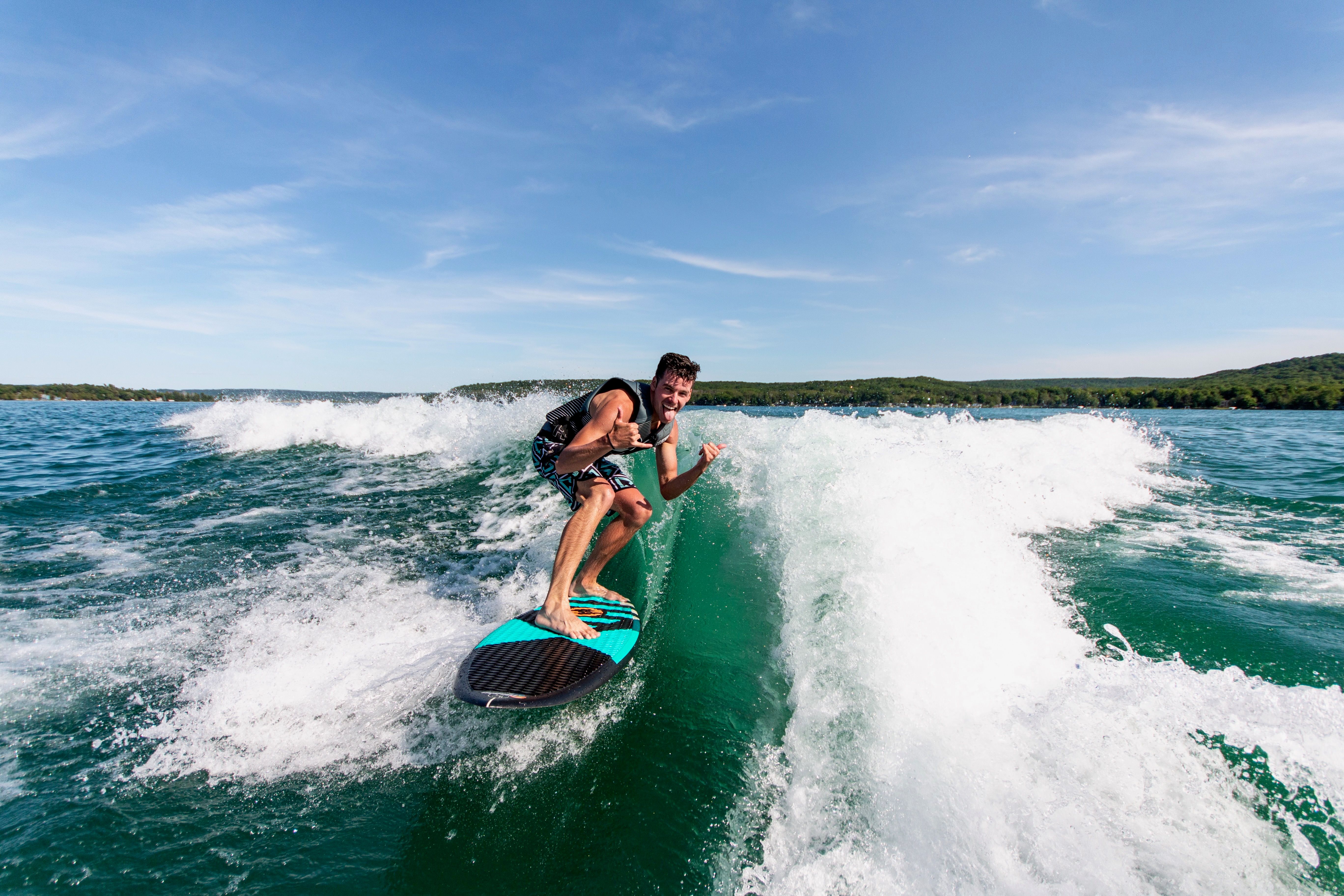 happy guy wakesurfing