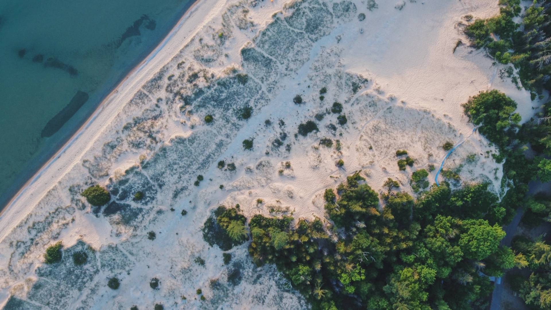 Top down aerial photo of the sand dunes and lake michigan at Petoskey State Park