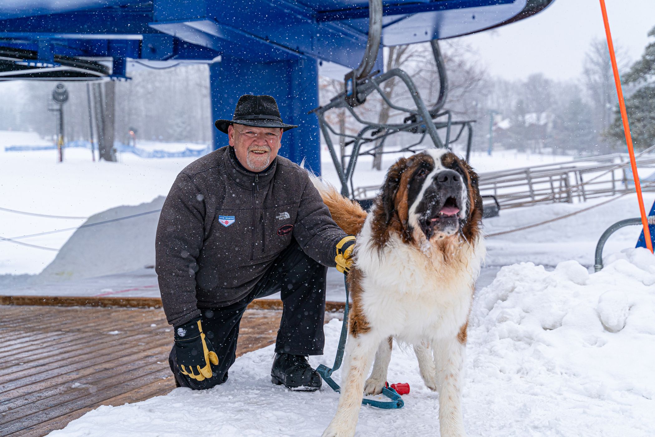 Duane at the base of Mountain Express with a dog