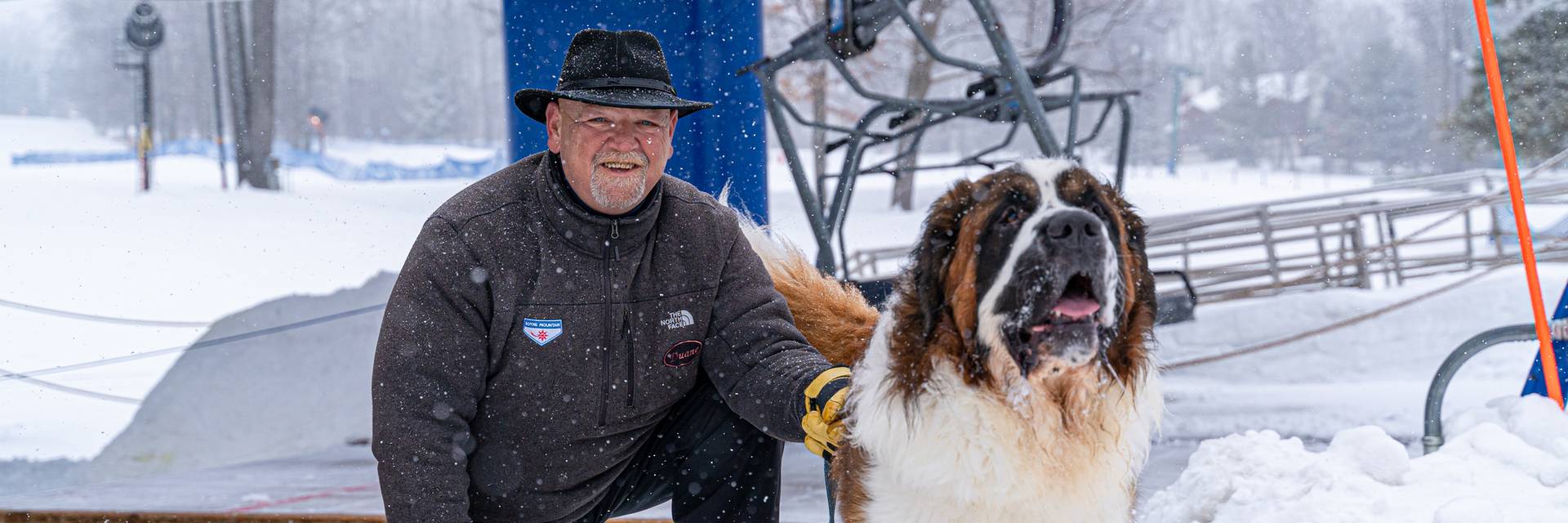 Duane at the base of Mountain Express with a dog