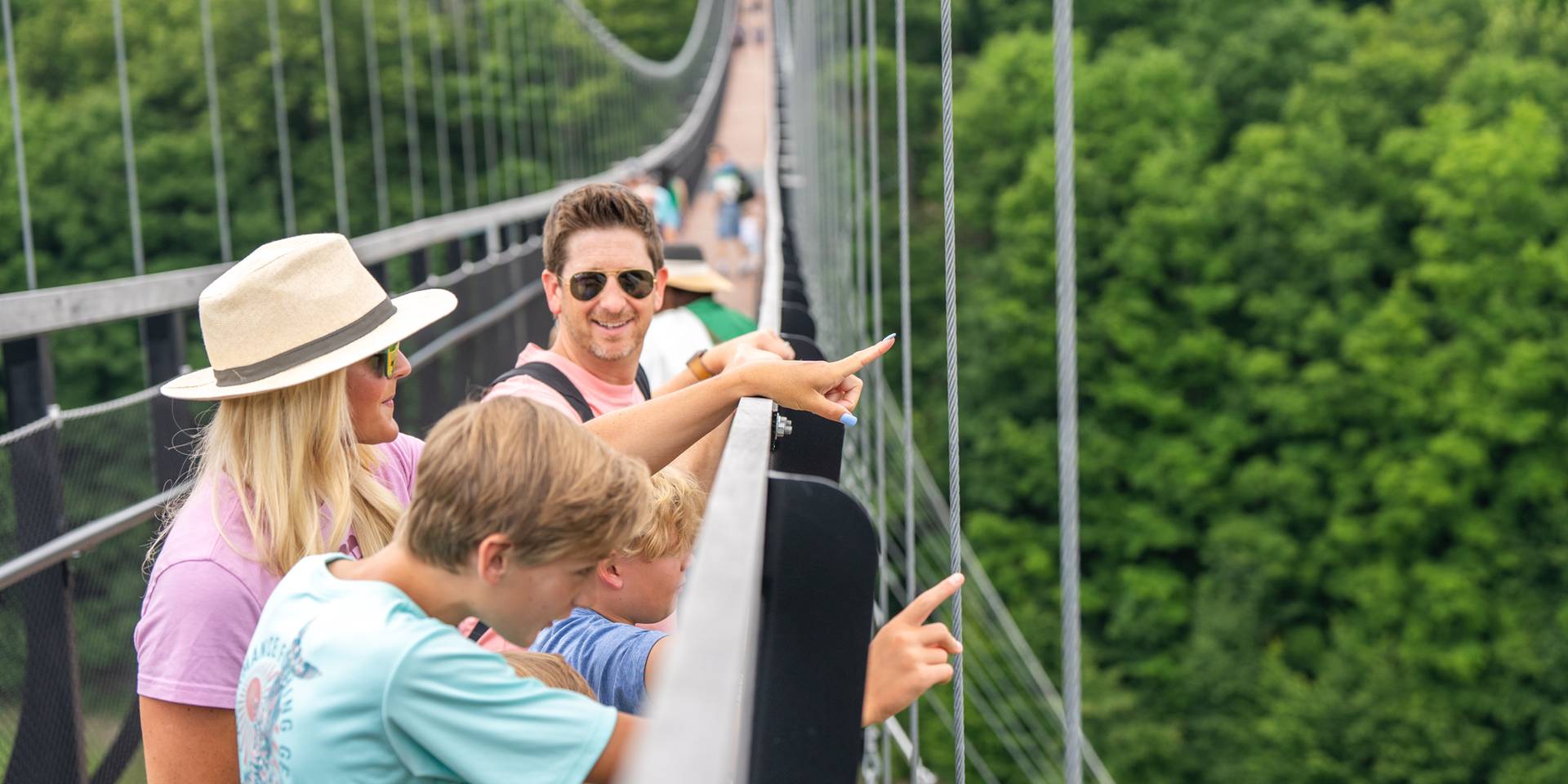 family on skybridge in the summer